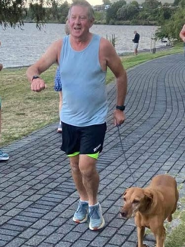 Runner mid-stride in RUNNR shorts
